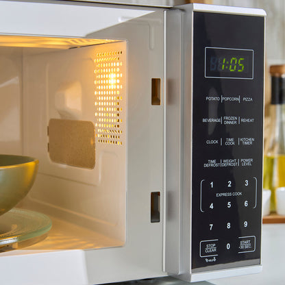 Microwave oven with digital display and control panel, showing the time '00:05'.