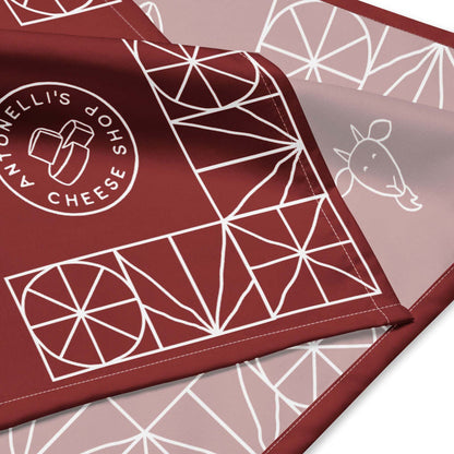 All-over print bandana with geometric design and cheese shop logo.