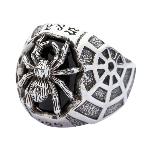 A solid sterling silver black onyx spider ring with a realistic 3D spider and a detailed, hand-carved spiderweb band.