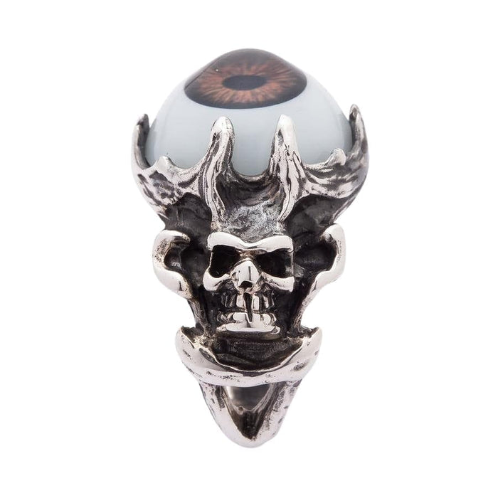 A side profile of the handcrafted silver skull ring, showing the bony band and the brown eyeball setting.
