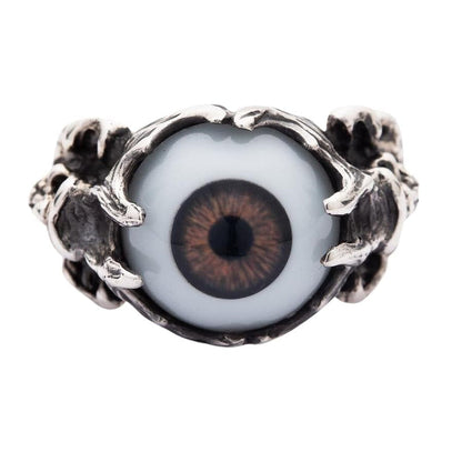 Top-down view of the brown eyeball ring, showing the realistic brown iris held by sterling silver bony claws.