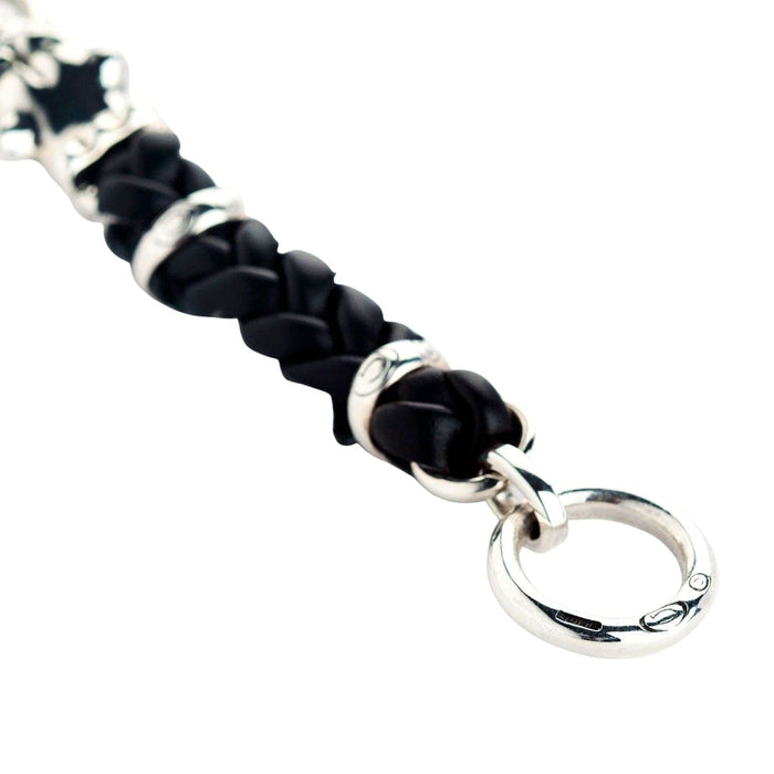 A close-up of the black braided leather band and the silver loop connector.