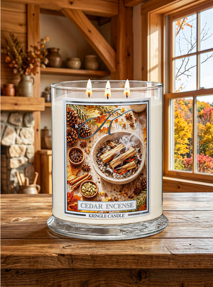Cedar Incense Candle by Kringle Candle in a lifestyle photo with fall decor