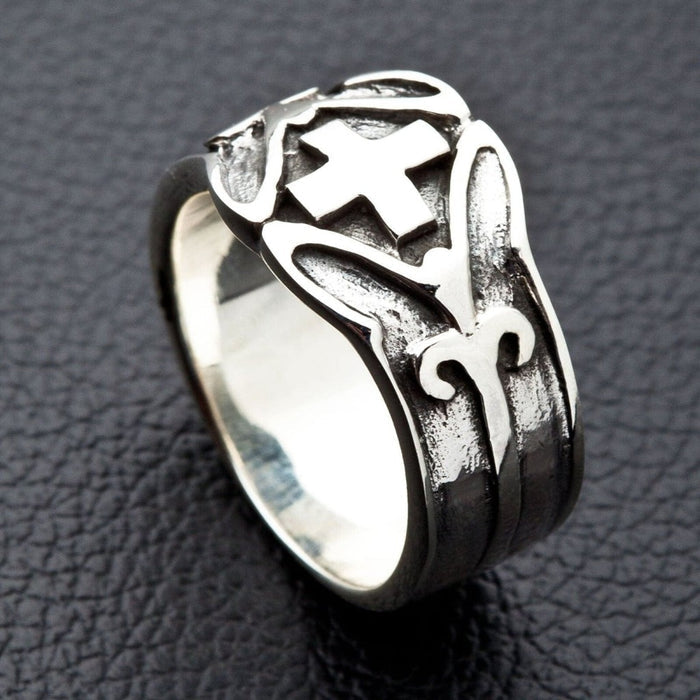 Artisan crafted silver ring side view on dark background