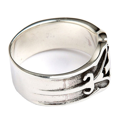 Angled view of handcrafted silver ring highlighting relief depth