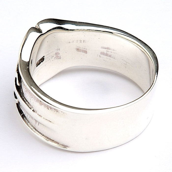 Back view of silver ring showing solid band construction