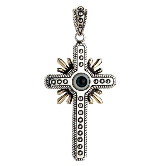 Front view of a sterling silver gothic cross pendant featuring a blue evil eye center and gold-toned sunburst rays.