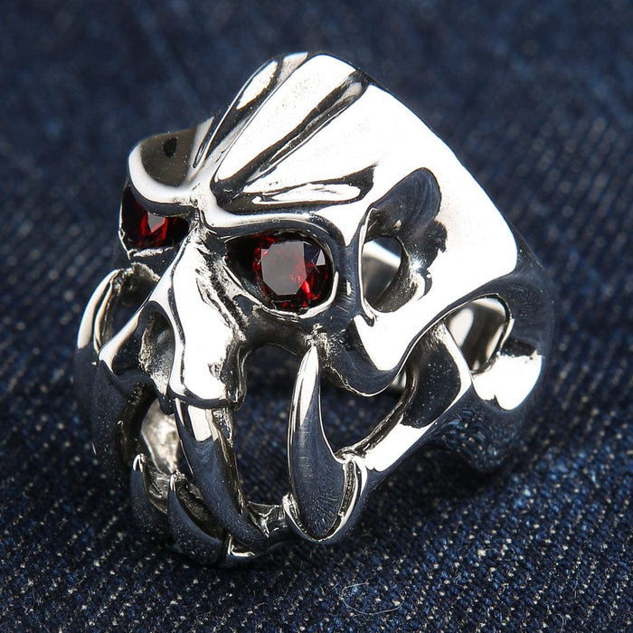 A side profile of the massive silver demon ring, showing its abstract openwork construction.