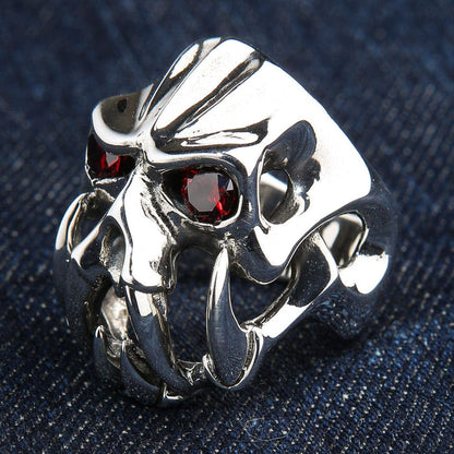 A side profile of the massive silver demon ring, showing its abstract openwork construction.