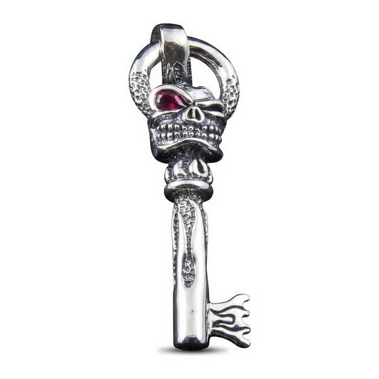 Front view of a .925 sterling silver flame skull key pendant with a red garnet eye and flame-tipped key bit