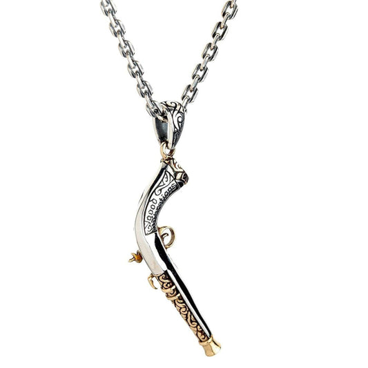 The men's gothic pirate gun pendant shown on a sterling silver chain as a complete necklace.