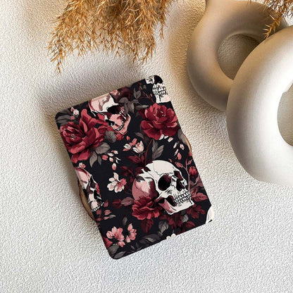 kindle case with floral and skull design on a textured surface