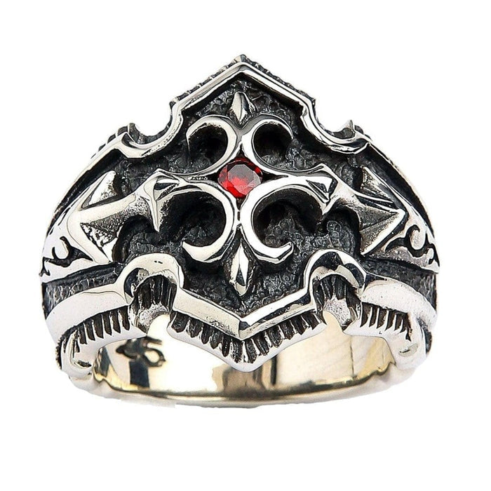 Front view of 925 sterling silver gothic shield ring featuring fleur-de-lis design and red garnet CZ center stone