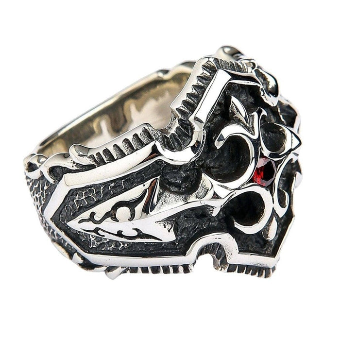Side angle view of handcrafted gothic cross ring showing intricate silver carving and textured details
