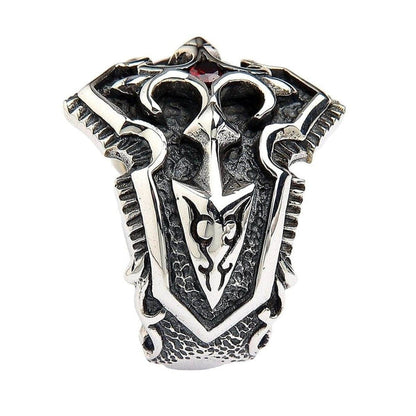 Top down view of sterling silver medieval shield ring displaying symmetrical Gothic pattern and red gemstone