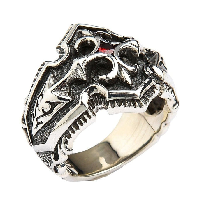 Three quarter angle of men's gothic sterling silver ring with oxidized finish highlighting raised details