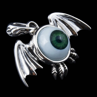 Side profile of handcrafted silver bat eye pendant showing bail