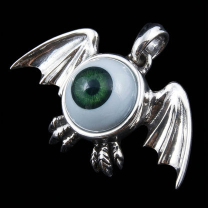 Detailed view of biker jewelry eyeball pendant claws and wings