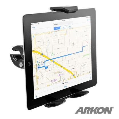 An iPad is securely held in the Heavy-Duty Clamp Post Tablet Mount for iPad, Note, Tab and more, displaying a digital map with a route. The sturdy black holder grips the device, featuring the ARKON logo at the bottom right corner.