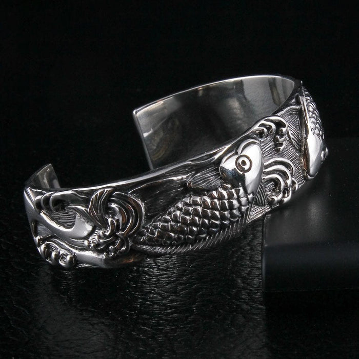 Handcrafted koi fish sterling silver cuff bracelet side angle with wave pattern details