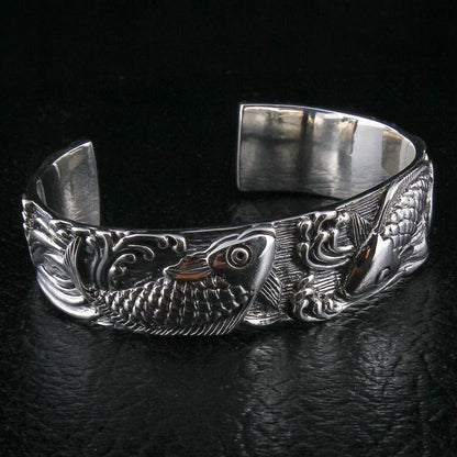 Koi fish silver cuff bracelet back view with flowing tail and wave motifs