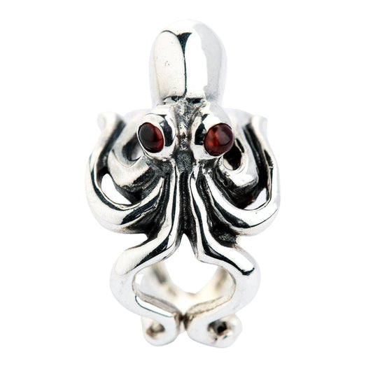 A front view of the ladies adjustable octopus ring in sterling silver, featuring red garnet eyes.