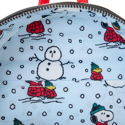 Close-up of a backpack with winter-themed designs featuring cartoon characters and snowflakes.