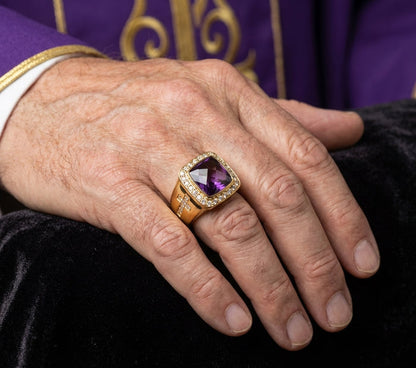 Realistic close-up of a bishop wearing an elegant ring with a 3/4 inch by 3/4 inch face size in soft studio lighting