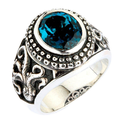 A men's ring featuring a genuine London Blue Topaz, set in a handcrafted octopus-themed silver band.
