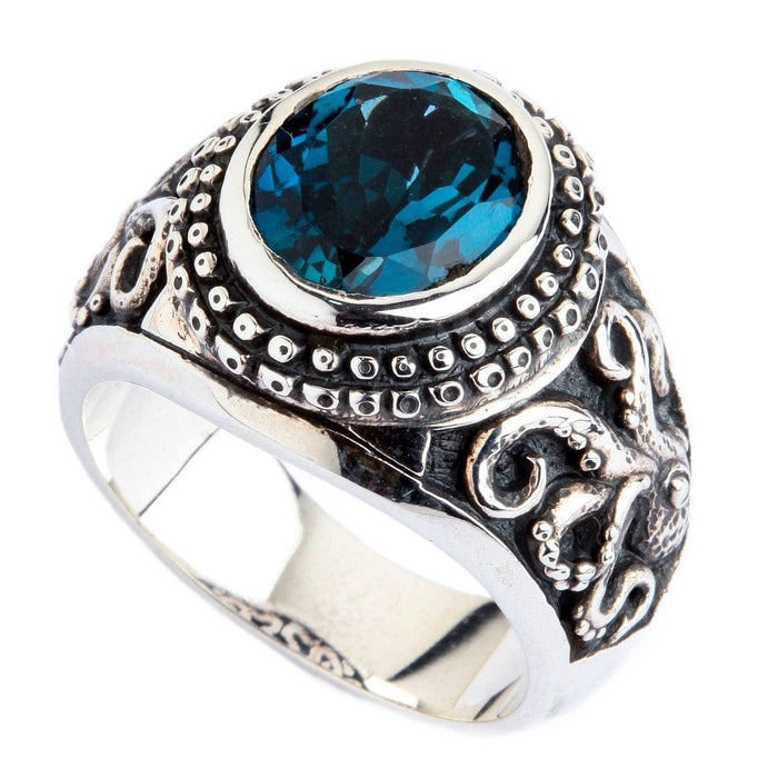 A gothic biker ring with an ocean theme, this piece features detailed tentacles and a blue gemstone.