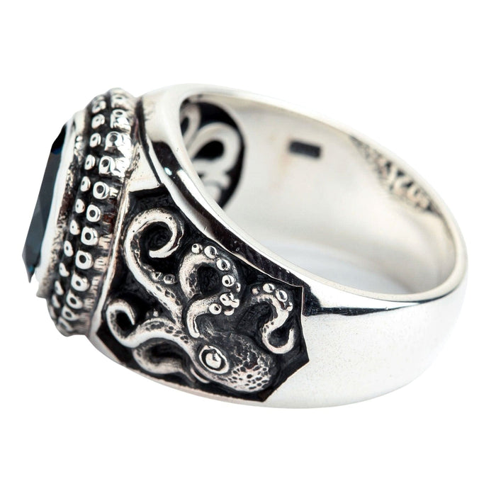 The side profile of the octopus ring, showing the intricate carving of the tentacles on the silver band.