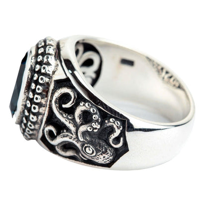 The side profile of the octopus ring, showing the intricate carving of the tentacles on the silver band.