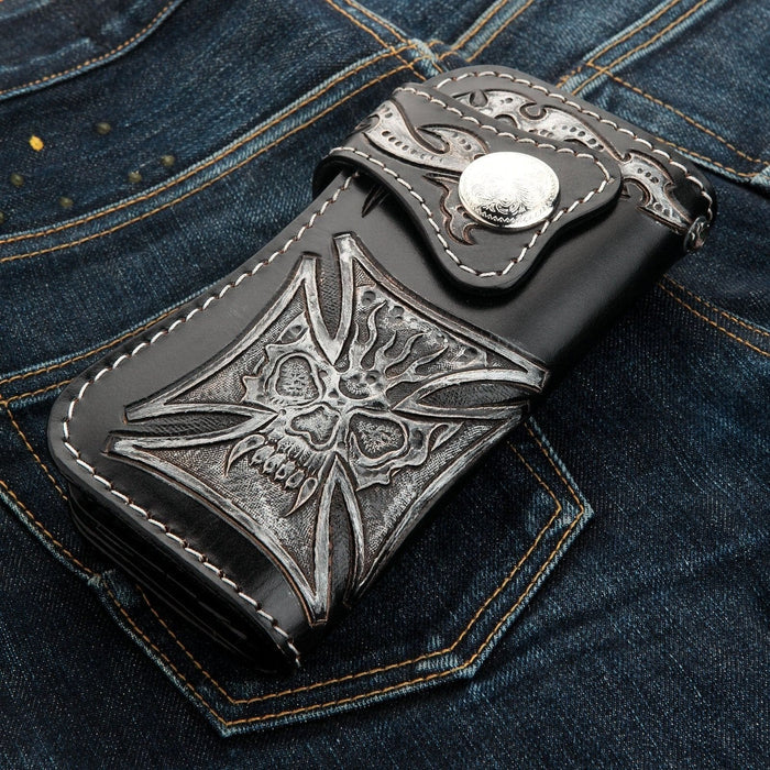 A premium, hand-tooled leather biker wallet featuring a unique phantom skull that seamlessly blends into a powerful Iron Cross.