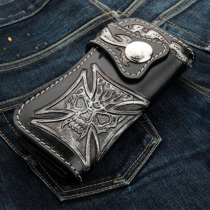 A premium, hand-tooled leather biker wallet featuring a unique phantom skull that seamlessly blends into a powerful Iron Cross.