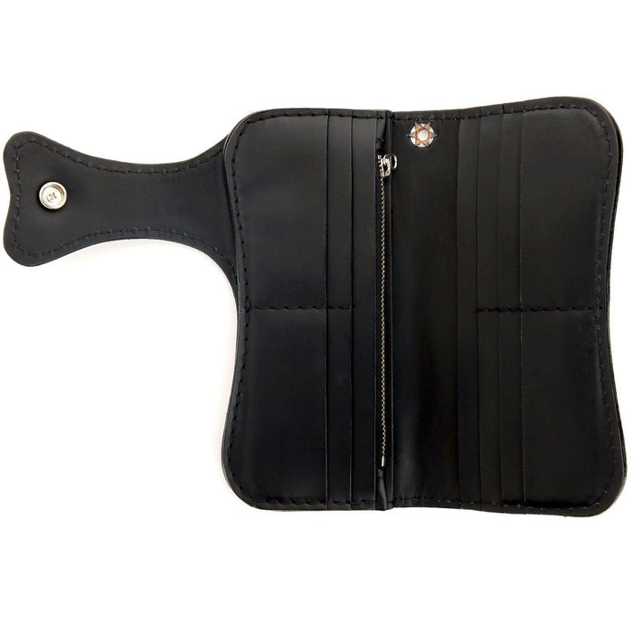 The black leather interior of a hand-tooled chain wallet with a unique skull and cross design.
