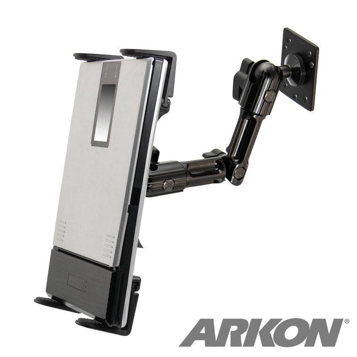 A black adjustable wall mount holds a rectangular silver device, serving as a versatile printer holder for Zebra, Epson, and Brother portable printers. The ARKON logo appears in bold gray at the bottom right corner.