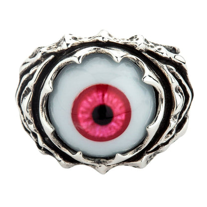 Top view of a sterling silver ring featuring a large polymer eyeball with a deep crimson iris held in a jagged claw setting.
