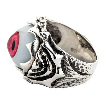Underside view displaying the smooth sterling silver lower band and the dark, textured hollow interior of the ring.