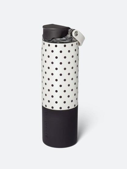 A reusable insulated bottle with a black and white polka dot pattern and a black base, shown on a light gray background.