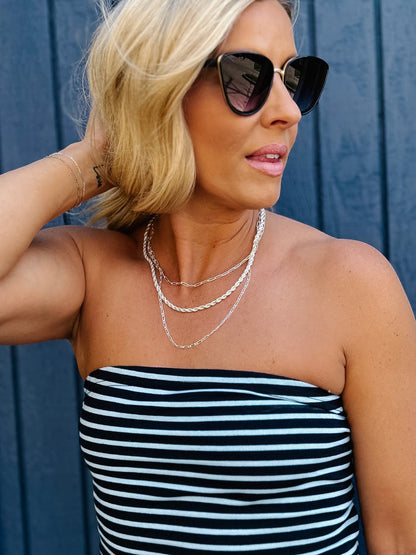 Woman wearing Scottie Triple Chain Necklace in Matte Silver with striped top
