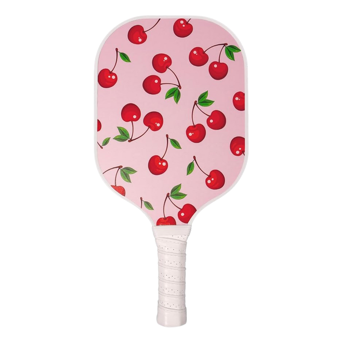 Front view of Single Pickleball Paddle, Cherry on Top print, showcasing pink cherry pattern and white wrapped grip on black background