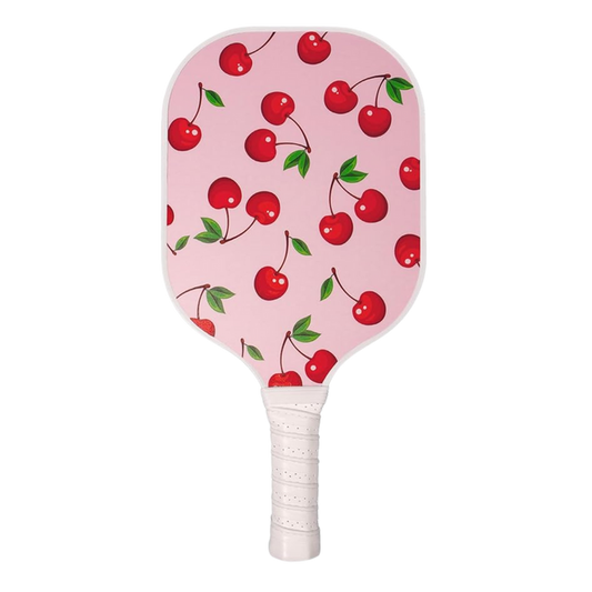 Front view of Single Pickleball Paddle, Cherry on Top print, showcasing pink cherry pattern and white wrapped grip on black background