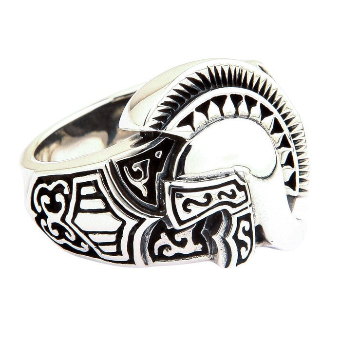 An angled view of the sterling silver Spartan helmet ring, showing the engraved band and polished crest.
