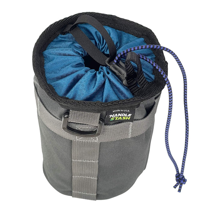 Charcoal stem bag with navy blue liner pulled closed.
