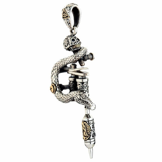 A sterling silver tattoo machine pendant with a coiling snake, sugar skull, and brass accents.