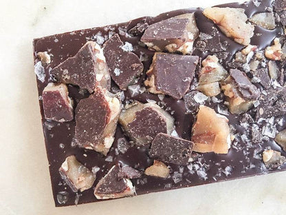 Texas Pecan Brittle Bar with dark chocolate and crunchy pecan brittle chunks.