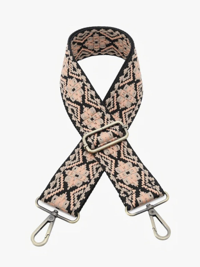 A woven shoulder strap with a geometric diamond pattern in beige and black, featuring silver-tone metal clips and a buckle, shown on a light gray background.
