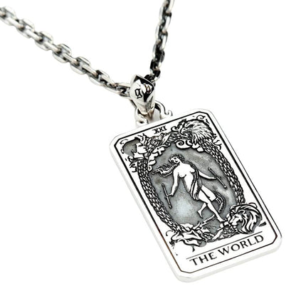 The sterling silver "The World" tarot card pendant shown on a silver chain as a complete necklace.