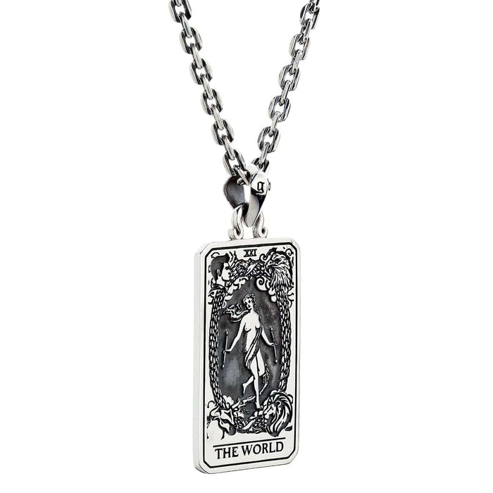 An angled view of the gothic Major Arcana "The World" pendant, showing its detailed carvings.