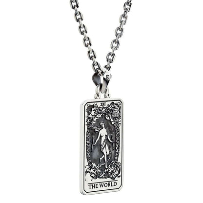 An angled view of the gothic Major Arcana "The World" pendant, showing its detailed carvings.